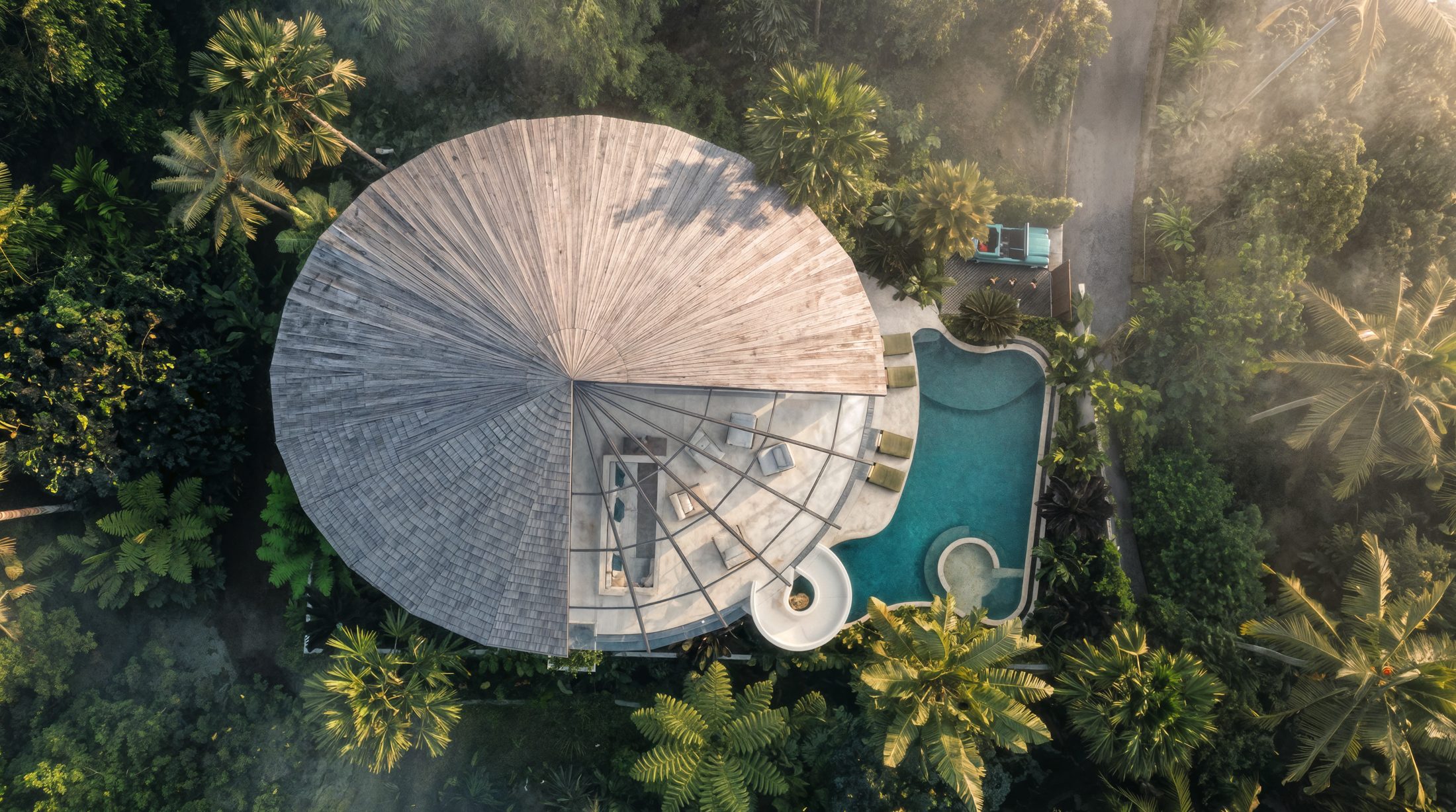 THE CANOPY · radial ulin timber roof seen from above, organic pool