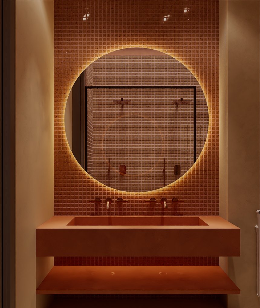 THE CURVE · terracotta bathroom with backlit round mirror
